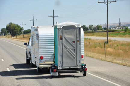 An interesting RV towing an outhouse