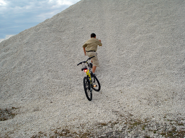 Alex Jones climbing a sand hill