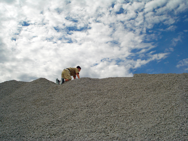 Alex Jones climbing a sandhill