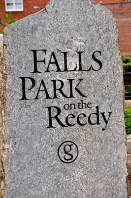 stone wall that says Falls Park on the Reedy
