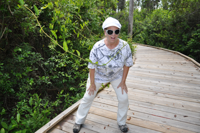 Karen gets attacked by a vine stretching over the boardwalk