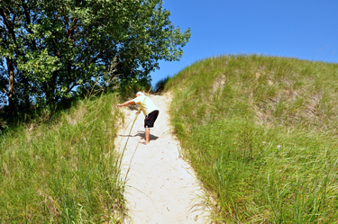 Lee starts to climb the second dune