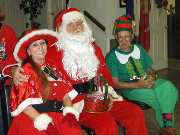 Karen Duquette and Santa Claus and an elf