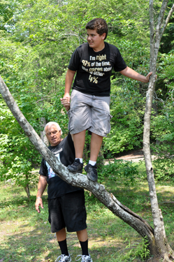 Alex climbing a tree