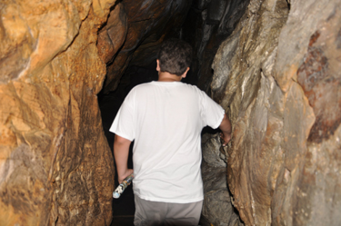 the grandson of the two RV Gypsies entering Fairyland Caverns at Rock City
