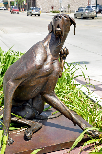 dog with an itch - sculpture