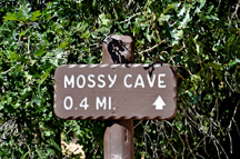 sign: Mossy Cave 0.4 miles