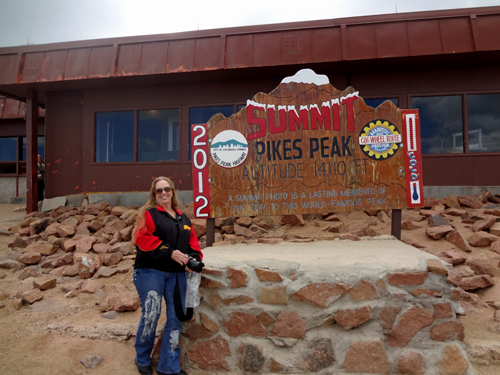 Karen Duquette at the summit of Pikes Peak