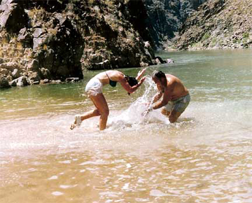 Lee and one of the other rafters play in the cold waters of the Grand Canyon