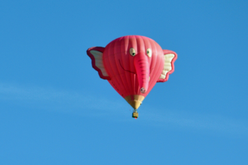 a flying pink elephant