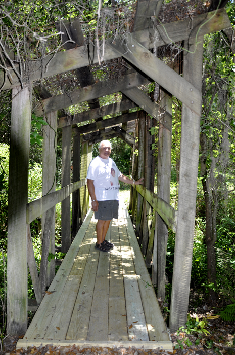 Lee Duquette on a bridge at Solomon's Castle