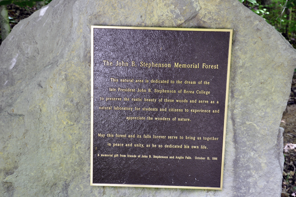 sign on a boulder at the entrance to the trail