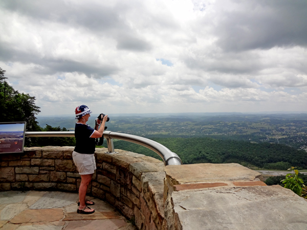 Karen Duquette standing in Virginia taking photos of Powell's Valley