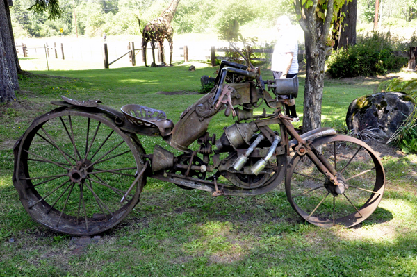 a broken down motor bike sculpture
