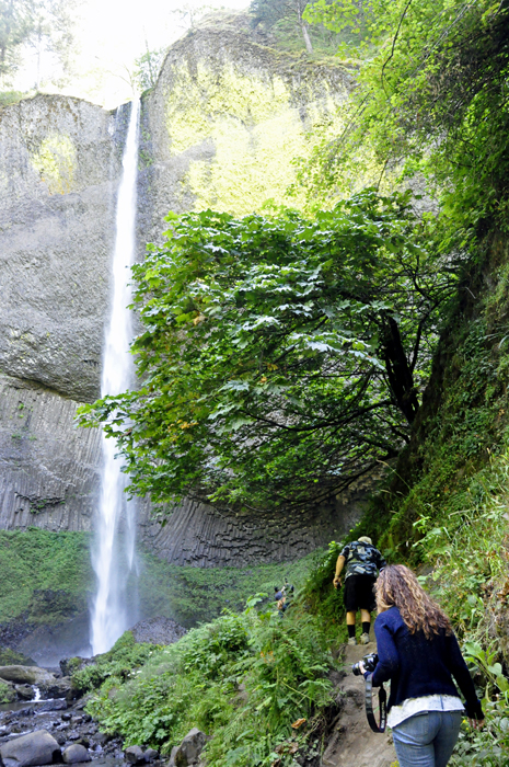 Lee and Ilse follow a narrow path to get a different view of?Latourell Falls.