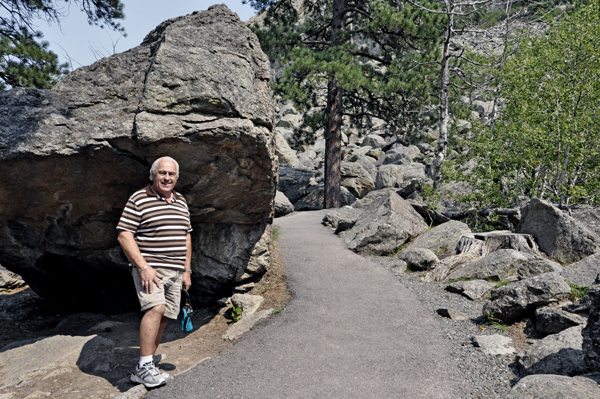 Lee Duquette by a big boulder from Devils Tower