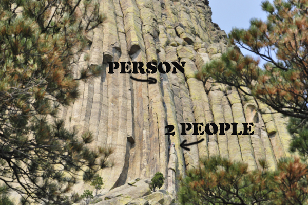 people climbing Devils Tower