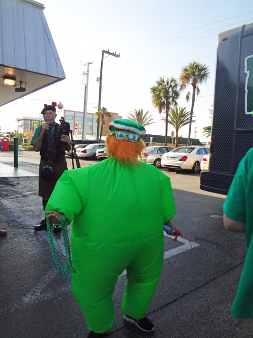 Bagpipe player and a green dude