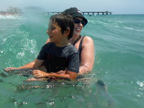 Karen Duquette and her great-grandson in the ocean