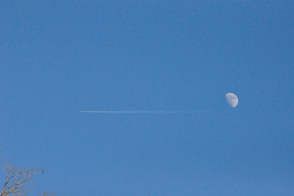 The moon and an airplane passing by