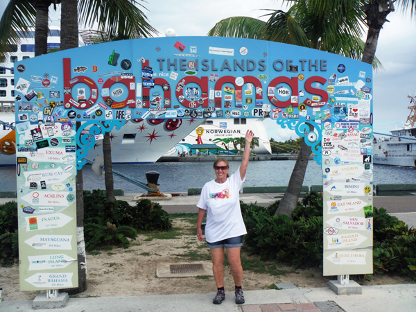 Karen Duquette at The islands of the Bahamas sign