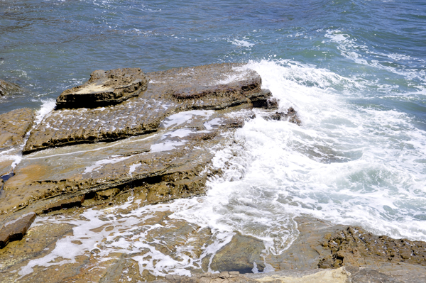 waves washing over rocks