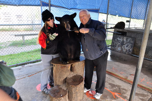 Lee Duquette feeds a black bear