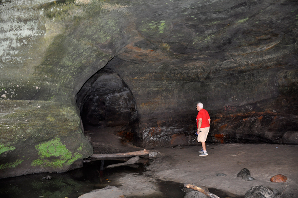 Lee Duquette entering a caves near Cascade Falls
