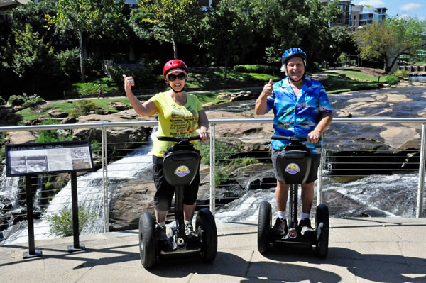 The two RV Gypsies on Segways at Falls Park on the Reedy