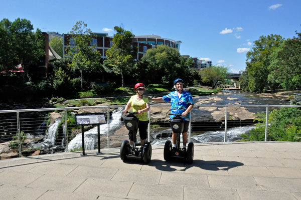 The two RV Gypsies on Segways at Falls Park on the Reedy