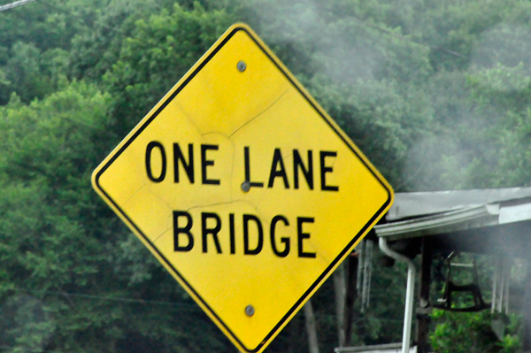 one lane bridge sign