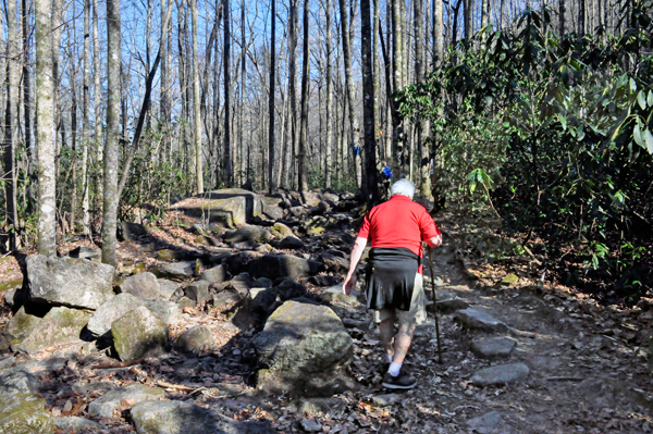 Lee Duquette on the path near big rocks