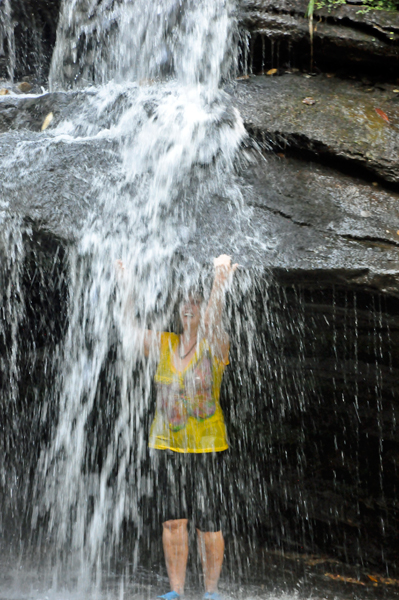 Karen Duquette behind the waterfall