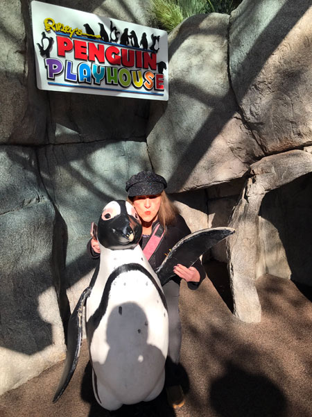 Karen Duquette and a Penguin statue