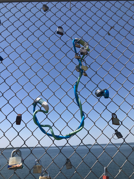 a backwards J on the fence with locks