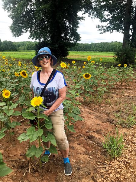 Karen Duquette and a sunflower