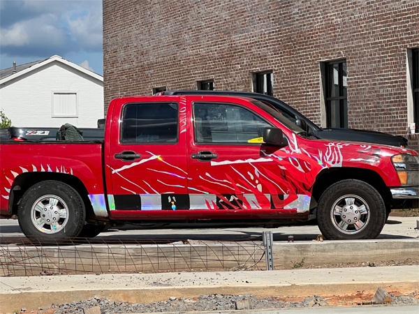 a pick-up trurk with a unique paint job