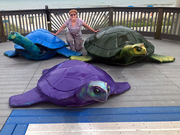 Karen Duquette with some big sea turtles