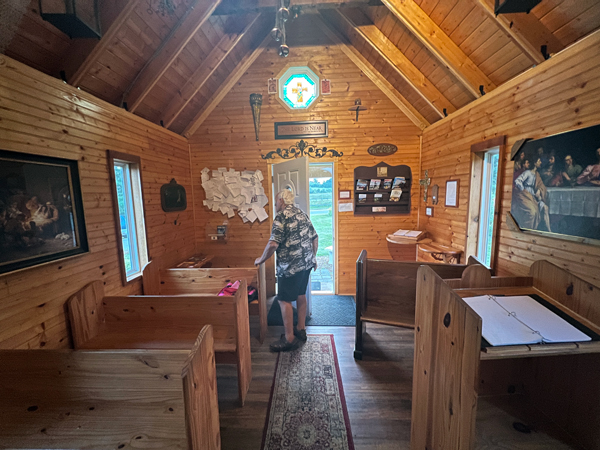 Lee Duquette inside Wytheville's smallest church