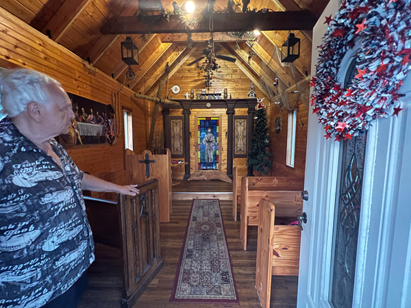Lee Duquette inside Wytheville's smallest church