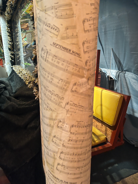 A pole wrapped in music notes