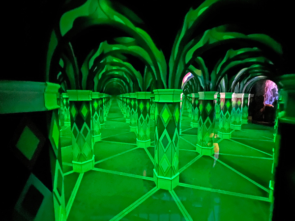 green Colored lights in the mirror maze