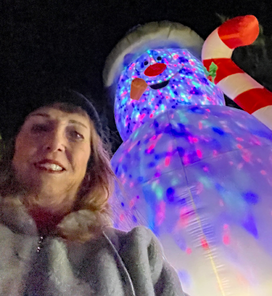 Karen Duquette and a very tall Snowman