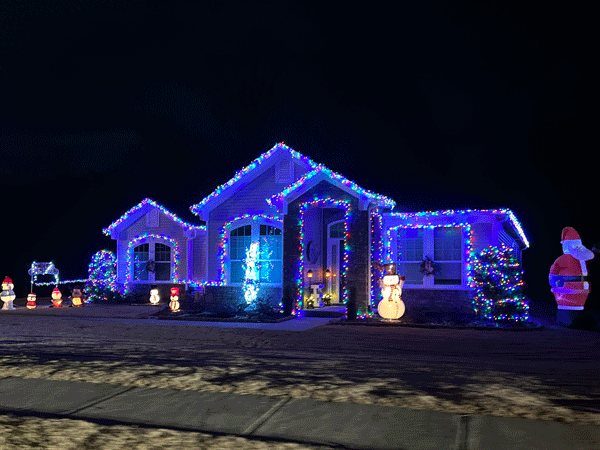 house in blue lights with Santa Claus