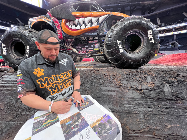 Berto Trevino signing Karen Duquette's flag