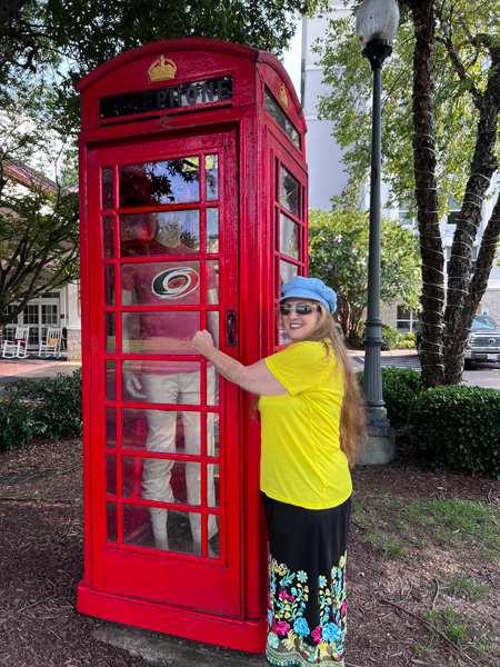 Karen Duquette and due in the phone booth