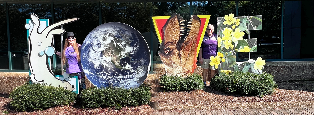 Karen and Lee Duquette at a Love sign