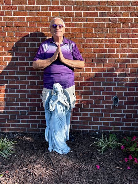 Lee Duquette and an Angel statue