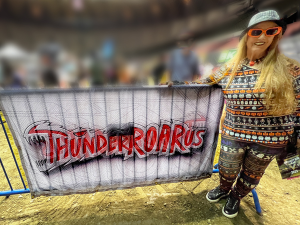 Karen Duquette with a ThunderROARus banner