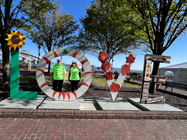 Lee and Karen Duquette in a  Love sign